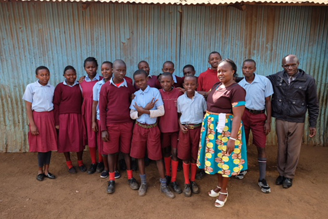 Kenya : September 2018 : Head teacher Alice with teacher Thomas and some of our older students